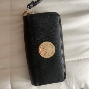 Black MK wallet two pockets.